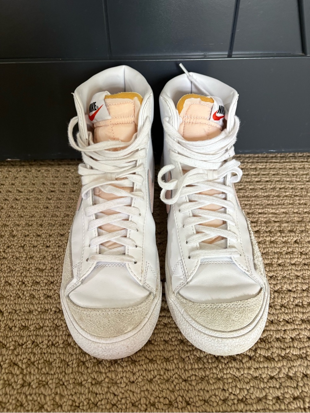 Nike White High-Top Sneakers with Pale Peach Tongue and Red Swoosh